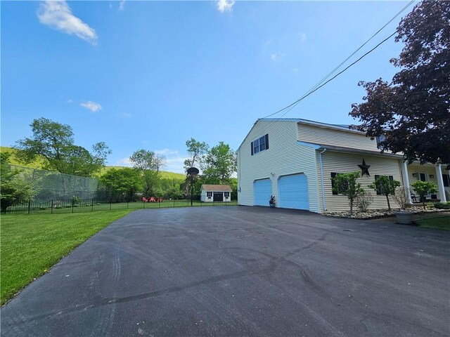 4862 Cross St, Campbell, NY 14821 - view of home's exterior featuring asphalt driveway and an attached garage