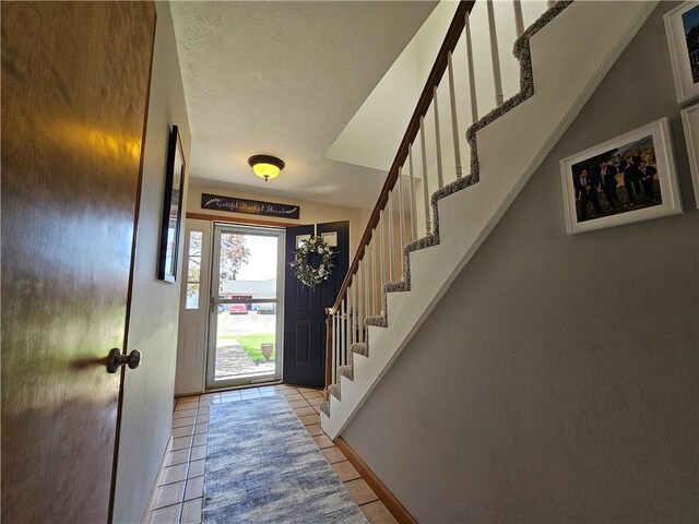 4862 Cross St, Campbell, NY 14821 - entryway featuring stairway, light tile patterned floors, and baseboards