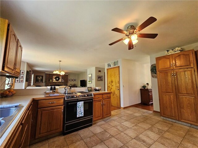 4862 Cross St, Campbell, NY 14821 - kitchen featuring black stove, a peninsula, a sink, brown cabinets, and ceiling fan