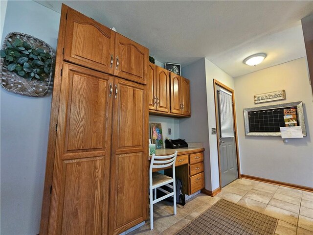 4862 Cross St, Campbell, NY 14821 - office with built in desk, light tile patterned flooring, and baseboards