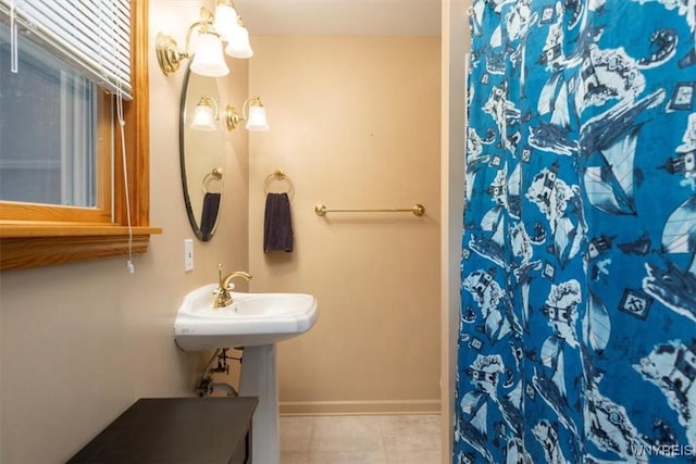 9910 Shorecliff Rd, Evans, NY 14006 - full bath with tile patterned flooring, a shower with curtain, baseboards, and a sink