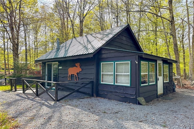 123 Mohawk Dr W, Webb, NY 13420 - view of side of home with metal roof