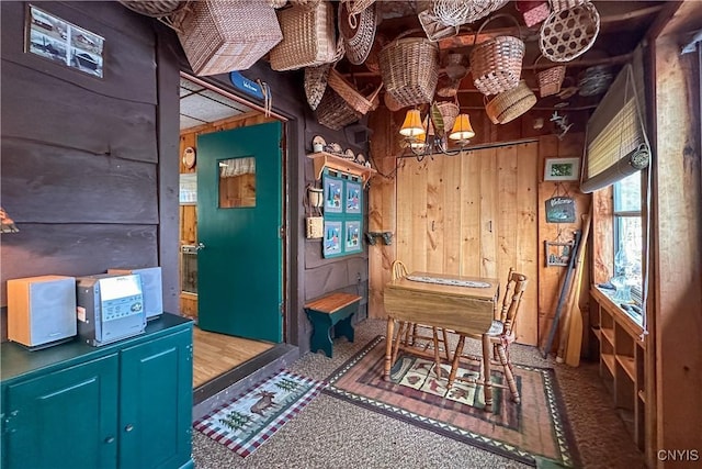 123 Mohawk Dr W, Webb, NY 13420 - dining space with wood walls and a chandelier