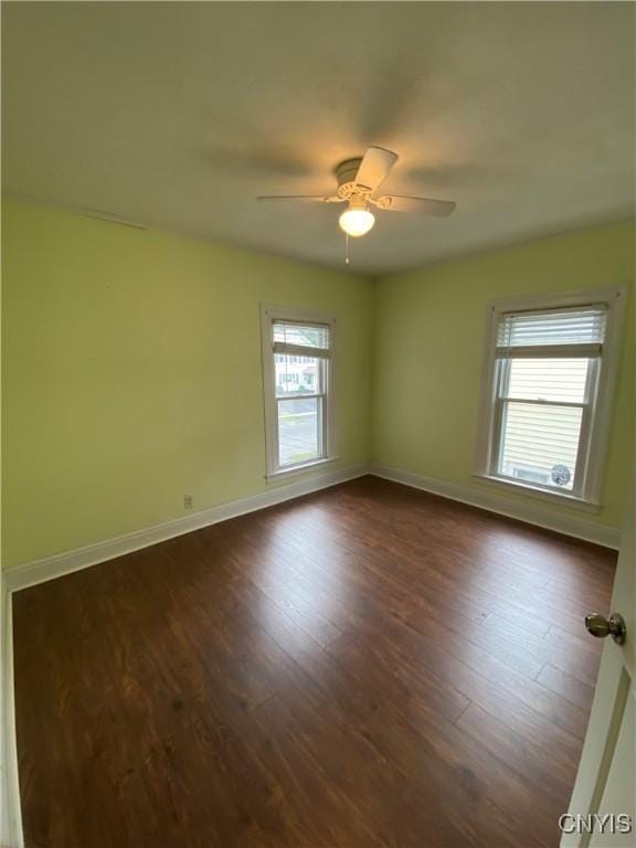 533 Mundy St, Watertown-City, NY 13601 - unfurnished room featuring dark wood finished floors, baseboards, and a ceiling fan