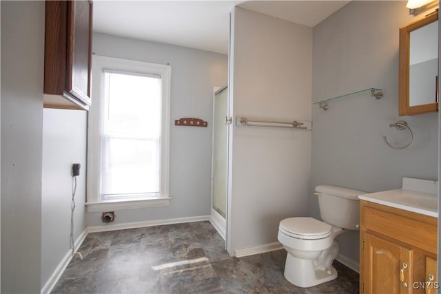 533 Mundy St, Watertown-City, NY 13601 - bathroom with a shower stall, toilet, vanity, and baseboards
