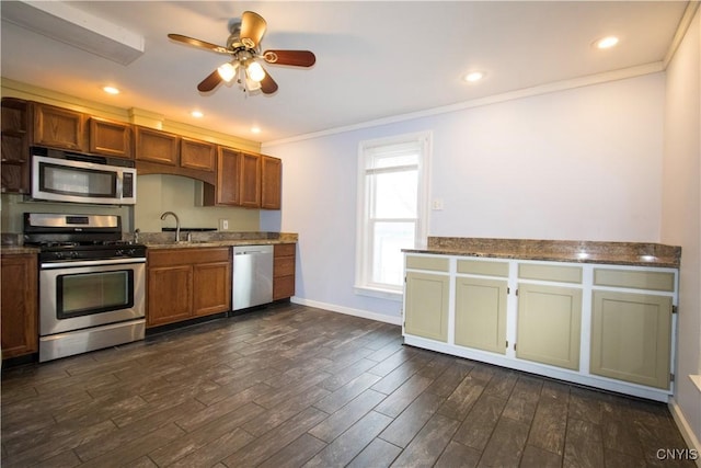 533 Mundy St, Watertown-City, NY 13601 - kitchen featuring stainless steel appliances, dark wood-style flooring, ornamental molding, a sink, and baseboards