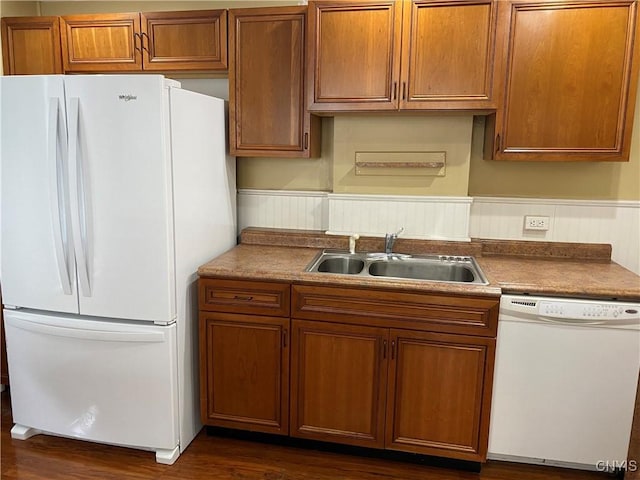 533 Mundy St, Watertown-City, NY 13601 - kitchen with white appliances, a sink, brown cabinetry, dark wood-style flooring, and a wainscoted wall