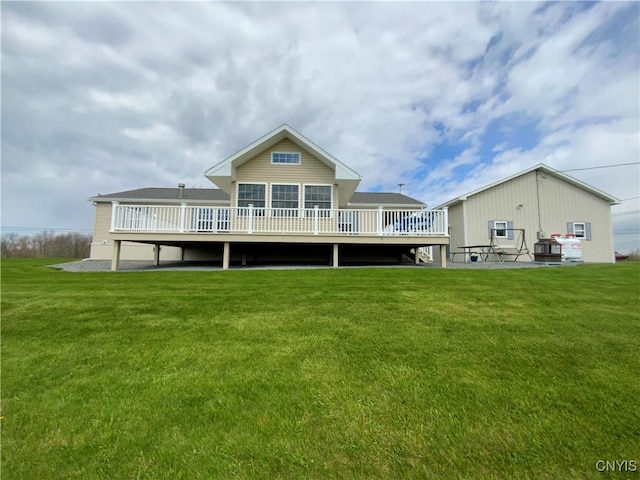 2570 Humphrey Rd, Cape Vincent, NY 13618 - back of property with a deck and a lawn