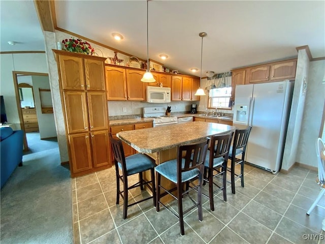 2570 Humphrey Rd, Cape Vincent, NY 13618 - kitchen with white appliances, vaulted ceiling, a kitchen island, light countertops, and hanging light fixtures