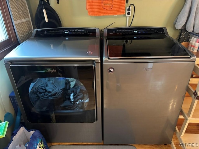 158 E Main St, Concord, NY 14141 - laundry room featuring separate washer and dryer and wood finished floors