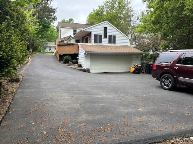 158 E Main St, Concord, NY 14141 - view of front of house with asphalt driveway and an attached garage