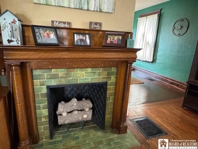 416 Robin St, Dunkirk-City, NY 14048 - detailed view of a tiled fireplace and baseboards