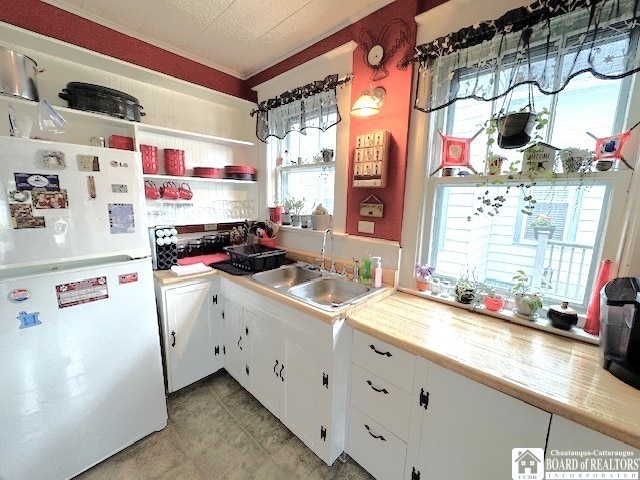416 Robin St, Dunkirk-City, NY 14048 - kitchen with freestanding refrigerator, a sink, open shelves, and light countertops
