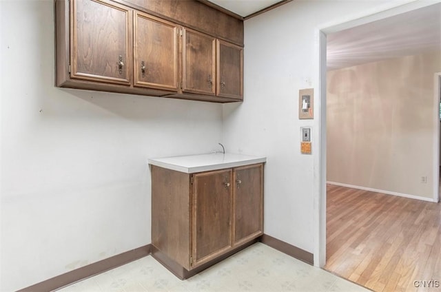 115 Stafford Dr, Rutland, NY 13612 - clothes washing area with baseboards and light wood-style floors
