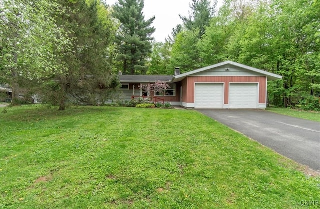 115 Stafford Dr, Rutland, NY 13612 - single story home featuring an attached garage, asphalt driveway, a front yard, and a chimney