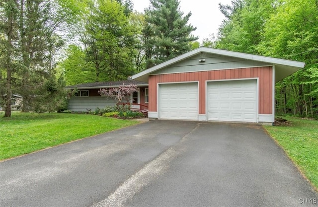 115 Stafford Dr, Rutland, NY 13612 - single story home featuring a garage, a front lawn, and driveway