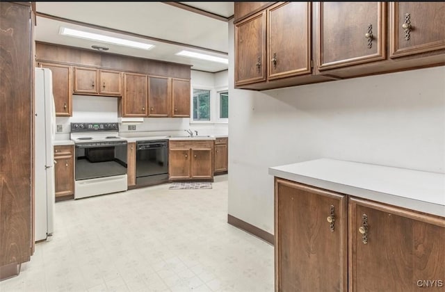 115 Stafford Dr, Rutland, NY 13612 - kitchen with white appliances, a sink, light floors, and light countertops