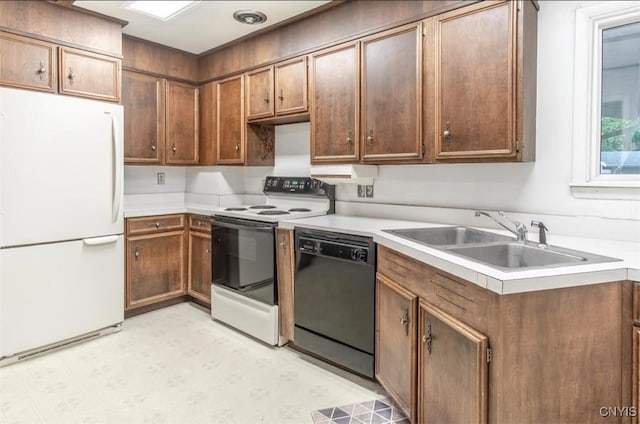 115 Stafford Dr, Rutland, NY 13612 - kitchen with white appliances, a sink, light countertops, and light floors