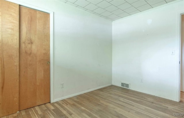 115 Stafford Dr, Rutland, NY 13612 - unfurnished bedroom featuring wood finished floors, a closet, and baseboards