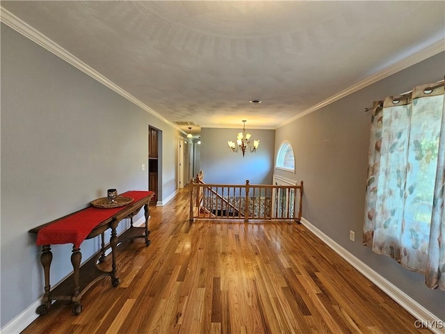 5813 Grace Rd, Deerfield, NY 13502 - empty room with a chandelier, wood finished floors, ornamental molding, and baseboards