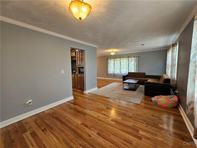 5813 Grace Rd, Deerfield, NY 13502 - living room featuring baseboards, ornamental molding, and wood finished floors