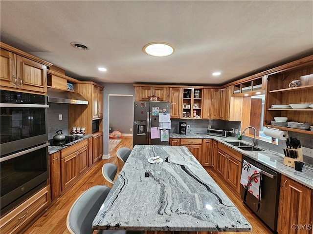 5813 Grace Rd, Deerfield, NY 13502 - kitchen featuring open shelves, appliances with stainless steel finishes, a sink, wall chimney exhaust hood, and light wood finished floors