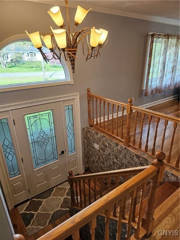 5813 Grace Rd, Deerfield, NY 13502 - entryway featuring a chandelier, crown molding, and stairs