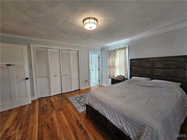 5813 Grace Rd, Deerfield, NY 13502 - bedroom featuring crown molding, wood finished floors, a closet, and baseboards