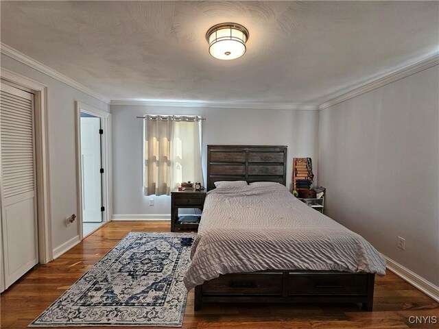 5813 Grace Rd, Deerfield, NY 13502 - bedroom featuring baseboards, wood finished floors, and crown molding