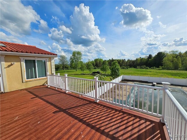 5813 Grace Rd, Deerfield, NY 13502 - wooden deck with a fenced backyard