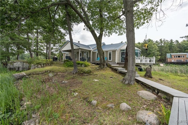1 Haloah, Hammond, NY 13646 - rear view of property featuring a deck and metal roof