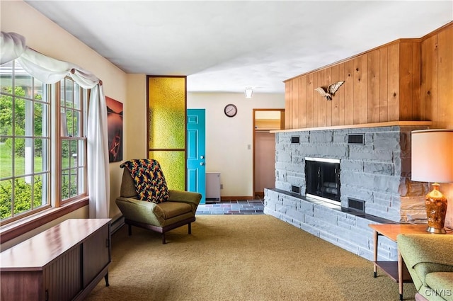 carpeted living area featuring a fireplace