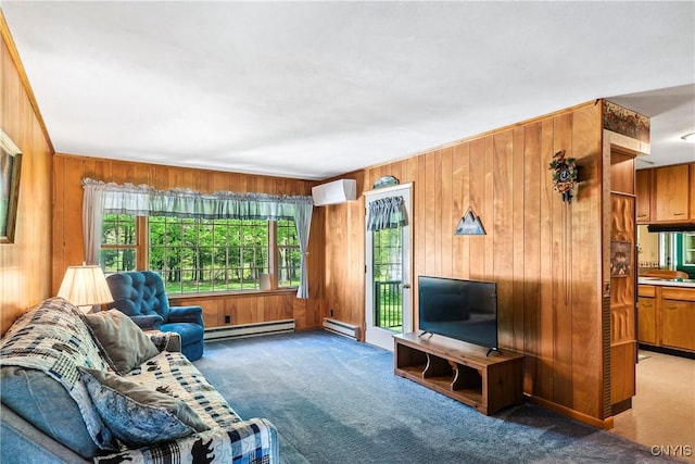 living area with carpet floors, a baseboard heating unit, an AC wall unit, plenty of natural light, and wood walls