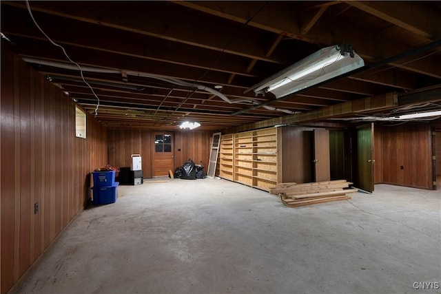 unfinished below grade area with wood walls