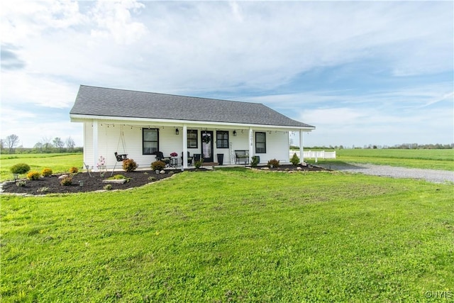26618 Three Mile Point Rd, Lyme, NY 13622 - view of front of home featuring covered porch, a front lawn, and driveway