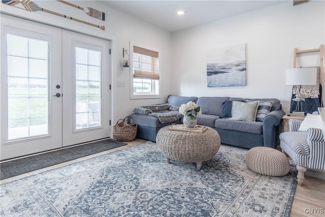 26618 Three Mile Point Rd, Lyme, NY 13622 - living area with french doors, wood finished floors, and recessed lighting