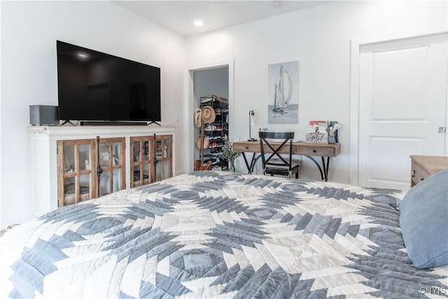26618 Three Mile Point Rd, Lyme, NY 13622 - bedroom featuring a walk in closet, a closet, and recessed lighting