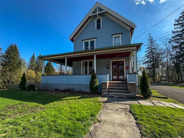 442 Front St, Owego, NY 13827 - view of front facade with french doors, a porch, and a front lawn