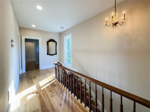 442 Front St, Owego, NY 13827 - hall with a chandelier, light wood finished floors, baseboards, and recessed lighting
