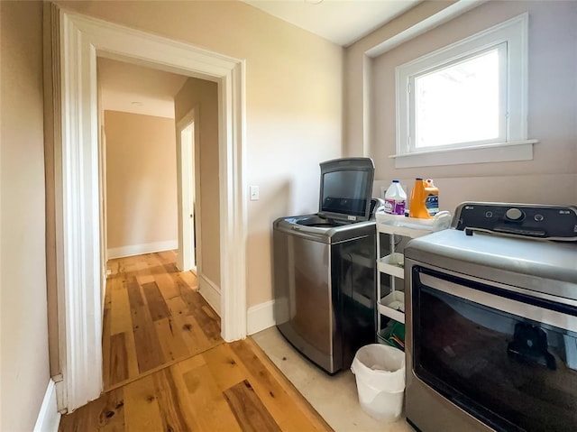 442 Front St, Owego, NY 13827 - laundry area featuring washer and dryer, baseboards, and light wood finished floors