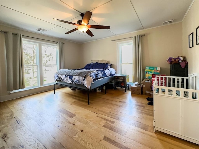 442 Front St, Owego, NY 13827 - bedroom featuring hardwood / wood-style floors, crown molding, and a ceiling fan