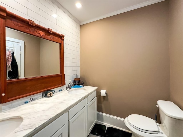 442 Front St, Owego, NY 13827 - bathroom featuring toilet, crown molding, double vanity, and baseboards
