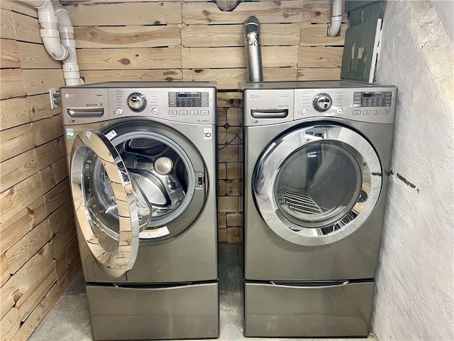 808 Center St, Horseheads, NY 14845 - washroom with washer and dryer and wooden walls