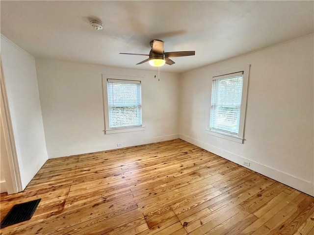 808 Center St, Horseheads, NY 14845 - unfurnished room with hardwood / wood-style floors, a ceiling fan, crown molding, and a smoke detector