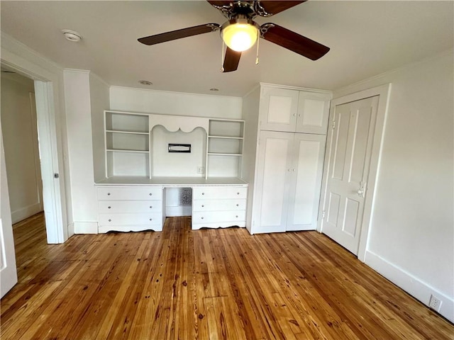 808 Center St, Horseheads, NY 14845 - unfurnished bedroom featuring ornamental molding, baseboards, hardwood / wood-style floors, and a ceiling fan