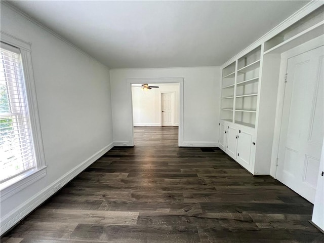 808 Center St, Horseheads, NY 14845 - empty room with dark wood-style floors, baseboards, a ceiling fan, and built in features