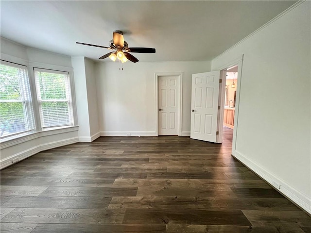 808 Center St, Horseheads, NY 14845 - unfurnished bedroom featuring dark wood-style floors, baseboards, crown molding, and ceiling fan
