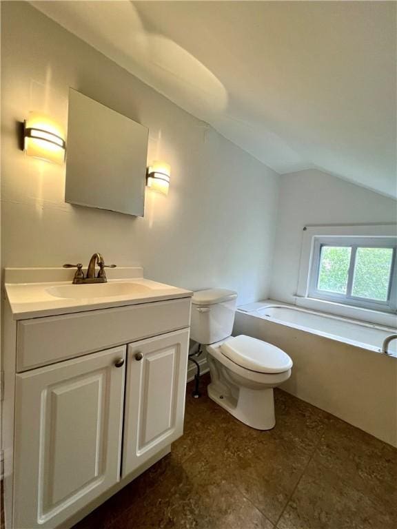 808 Center St, Horseheads, NY 14845 - bathroom featuring toilet, vanity, vaulted ceiling, and a bathtub