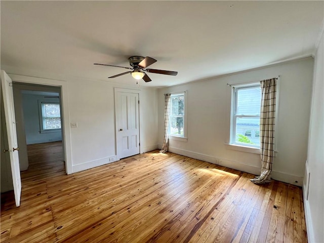 808 Center St, Horseheads, NY 14845 - unfurnished bedroom with multiple windows, light wood-style flooring, a closet, and baseboards