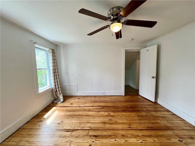 808 Center St, Horseheads, NY 14845 - spare room with light wood finished floors, crown molding, a ceiling fan, baseboards, and a smoke detector